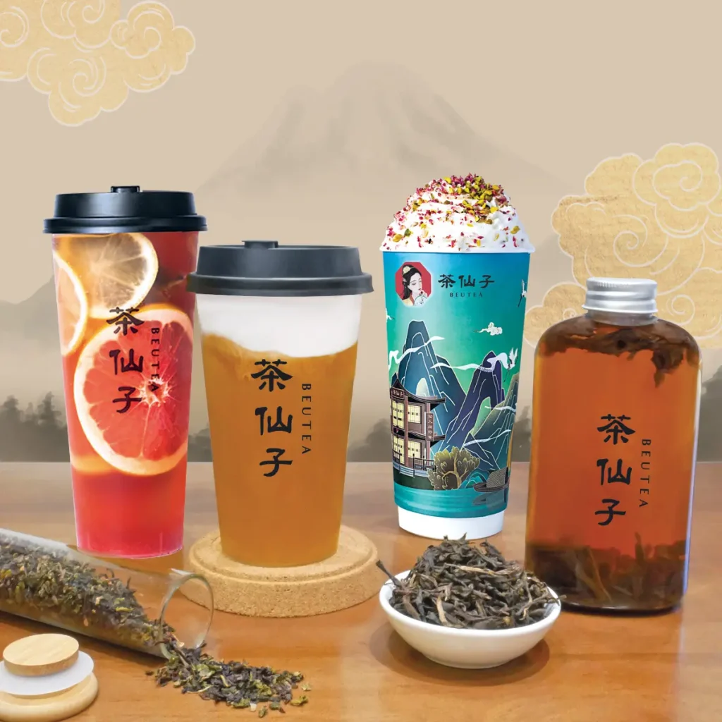 茶仙子饮品展示，多款奶茶、水果茶与瓶装冷泡茶摆放在桌面