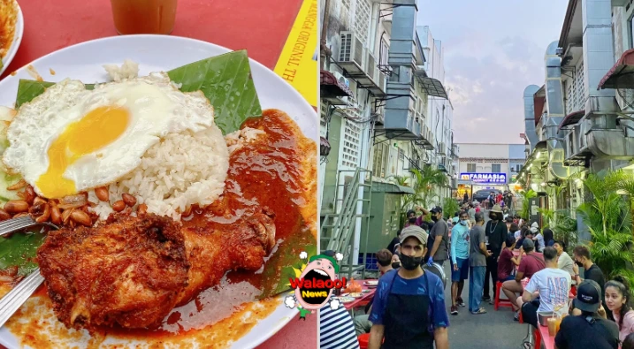 Nasi Lemak Bumbung的小巷长桌人潮拥挤，招牌椰浆饭搭配炸鸡、煎蛋与花生。
